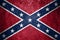 Close-up of grunge Confederate States of America flag. Dirty Confederate States of America flag on a metal surface