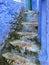 Close up of grungy blue, worn steps and wall, Chefchaouen, Morocco