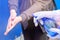 Close-up of guest getting her hands disinfecting while visiting a cafe after reopening