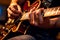 Close-up of a guitar players hands on the fretboard during a concert. Generative AI