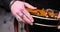 Close up of guitarist\'s hand plugging audio cable in electric guitar