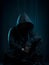 close up hacker in black hoodie in dark room