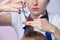 Close-up hair cutting. the barber`s hands hold the ends of the hair