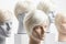 Close up hair wig over the plastic mannequin head isolated over the white background, mockup featuring contemporary men hairstyles