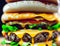 Close-up of Hamburgers with Cheese and Vegetables - AI generated