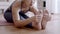 Close up hand Asian woman workout yoga sitting forward fold pose excercise on yoga mat at home