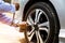 Close up hand of auto mechanic using wrench to changing a car tire.