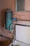 Close up of hand basin and oxidised water heater in derelict house built in 1930s deco style, Rayners Lane, Harrow UK