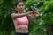 Close up hand beautiful woman wearing orange sports warm up before exercise. Sporty young woman warming up before running in