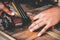 Close-up Hand of carpenter use gun fired a nail wood working  machine tool, furniture boxes at workshop