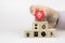 Close-up hand choose fire prevent icon on cube wooden toy blocks stacked with fire prevention icon