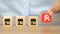 Close-up hand choose quality symbol on cube wooden toy blocks stacked with franchise business store icons