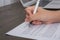 Close up of hand completing an employment application