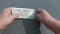 Close up of hand counting Indian five hundred notes on table. Money counting background finance and business concept. High angle