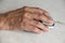 Close-up hand of an elderly man clicking a mouse, elderly people and digital devices and computers. Selective focus,