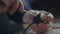 Close-up of a hand electrician working on wiring with a screwdriver