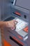 Close up of hand entering pin code at Automated Teller Machine