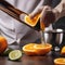 A close-up of a hand expertly zesting an orange peel over a classic cocktail2