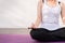 Close up of hand female practices yoga and meditation on the lotus posture