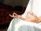 Close up Hand Gesture of Woman in white robe Doing Lotus Yoga Position, an Activity to Stay Physically, Mentally and Spiritually