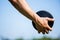 Close-up of hand holding a discus