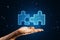 Close up of hand holding glowing digital blue jigsaw puzzle hologram on dark blurry background. Digital solution, collaboration,