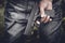 Close up of hand holding handgun in behind. Weapon and dangerous equipment concept. Criminal and Social issues theme