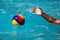 Close-up on a hand holding the water polo ball during the Greek