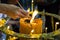 Close up hand light the joss stick at a big candle