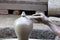 Close-up of the hand of a local potter creating a clay vase, Bhaktapur, Nepal