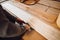 Close-up of hand of man adding glue during parquet installation