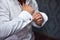 Close up of hand man how wears white shirt and cufflink