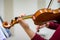 Close up of hand on neck of violin from behind