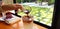 Close up hand of people pouring short of dark espresso coffee in glass of ice soda