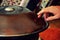 Close up of a hand playing a handpan perkusstion instrument
