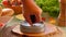 Close-up of the hand pressing minced meat into a form for making a meat cutlet