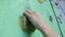 Close-up of the hand of a rock climber who trains his skills in the gym.