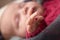Close Up Of Hand Of Sleeping Newborn Baby