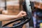 Close-up of a hand on the steering wheel of a forklift