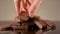 Close up of hand taking a piece of milk tasty chocolate lying on the table. Stock footage. Broken chocolate bar isolated