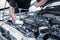 Close-up hand technician auto mechanic using the wrench to repairing change spare part car