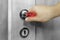 Close up hand touching door handle infected with bacteria or virus