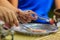 Close up hand of vendor during cooking for Crispy roll or tootsie Thai snack, Thai dessert Thai style food called \