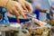 Close up hand of vendor during cooking for Crispy roll or tootsie Thai snack, Thai dessert Thai style food called \