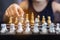 Close up hand of woman playing chess game, strategic business leadership successful teamwork.