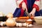 Close up hand woman wearing hanbok cutting vegetable with knife on table preparing cook kimchi traditional food in kitchen copy