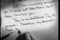 Close-up of hand writing \'Dear John\' letter then crumpling it up
