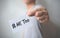 Close up hand of young man holding show a white card with word â€œMe Tooâ€. Social movement concept