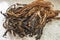 Close-up of a handful of dried vegetables on the table, Guangdong specialty dried cabbage