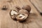 Close-up handful walnuts on the wooden surface